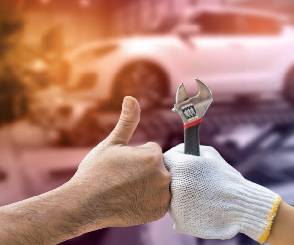 Mechanic,Hand,Checking,And,Fixing,A,Broken,Car,In,Garage.hand Mechanic,Hand,Checking,And,Fixing,A,Broken,Car,In,Garage.hand